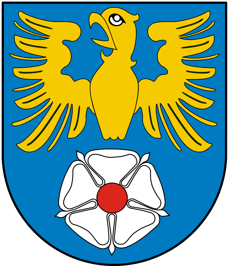 Herbem powiatu tarnogórskiego jest w polu błękitnym złoty (żółty) orzeł z odjętymi ogonem i nogami, pod którym znajduje się srebrna (biała) róża z czerwonym kielichem.